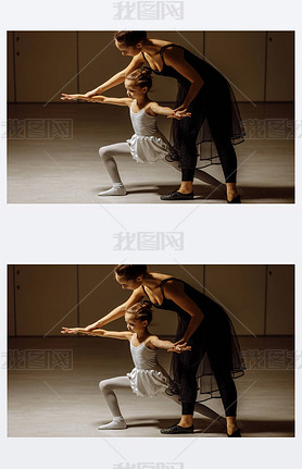 young ballerina woman training little girl in ballet studio