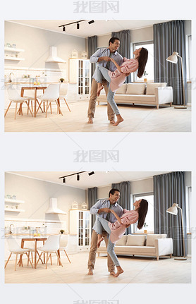 Lovely young interracial couple dancing at home