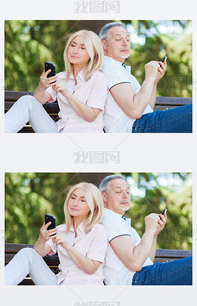 Mature couple using phones