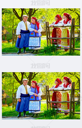 happy ukrainian family, dressed in national costumes, talking on the street