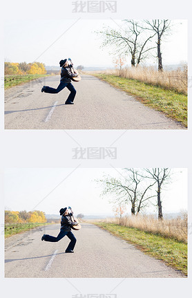 guitarist playing guitar crossing road