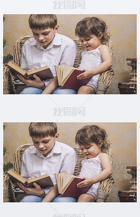 Cute babies boy and girl in a chair reading a book in a interior