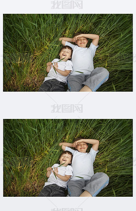 two happy boy lay in grass