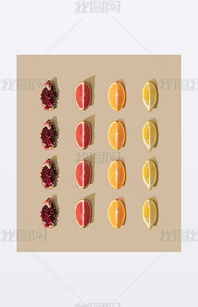 Minimal nature pattern with grapefruit and orange with pomegranate and lemon slices on pastel sand b