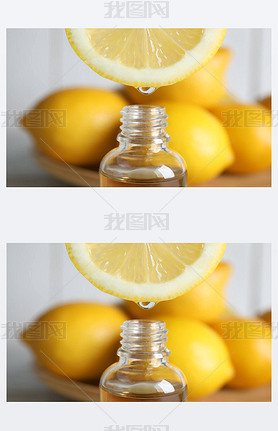 Citrus essential oil dripping from lemon slice into bottle, closeup