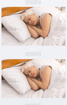 Senior lady sleeping in bed in morning, panorama