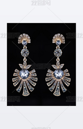 gold earrings with jewels on the black