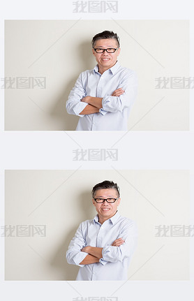 Portrait of mature Asian male arms crossed