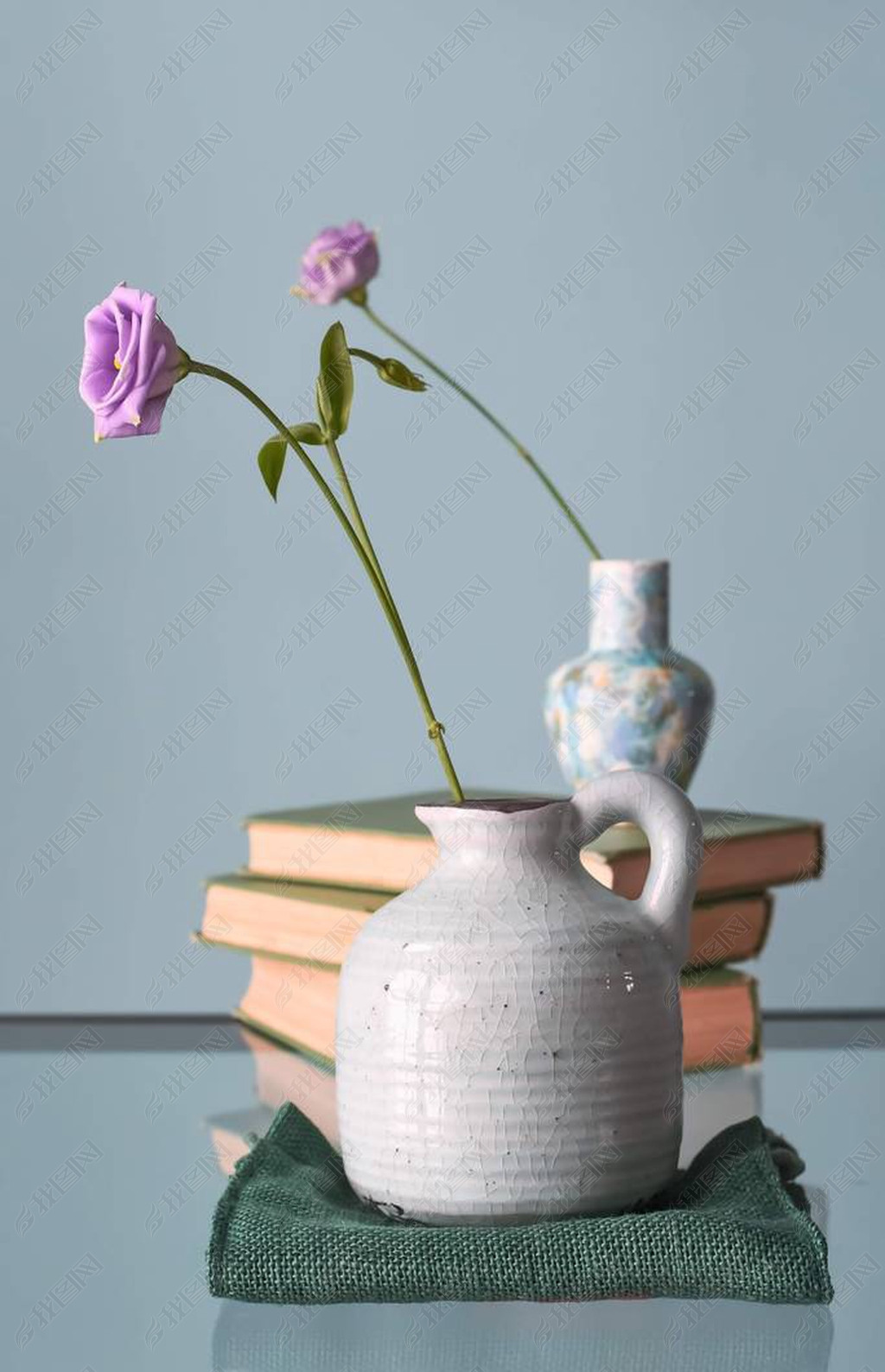 Retro home decor: a stack of books, flower in a vase