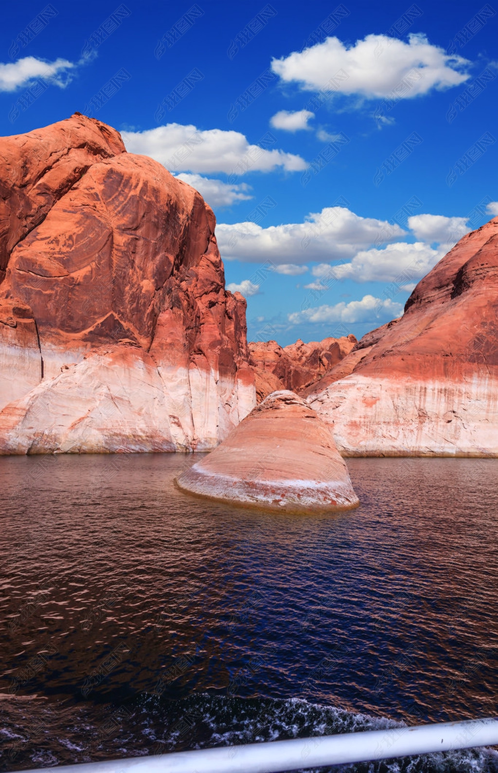 Red sandstone hills surround the lake