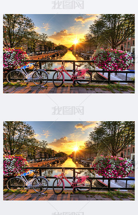 Beautiful sunrise over Amsterdam, The Netherlands, with flowers and bicycles on the bridge in spring