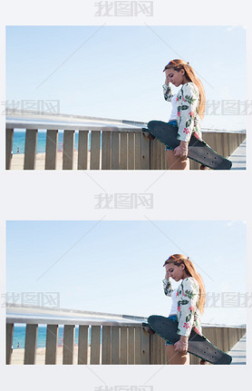 Woman with longboard while standing on bridge