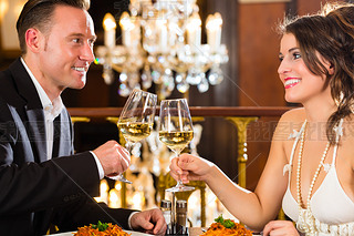 happy couple have a romantic date in restaurant