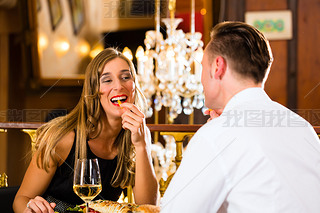 happy couple in restaurant eat fast food