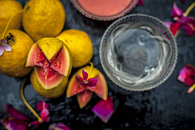 Guava face mask for glowing skin on a wooden surface with a blurred background consisting of some gu