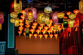 Decorative Chinese paper lantern hang on hotel lobby ceiling background with open lights on