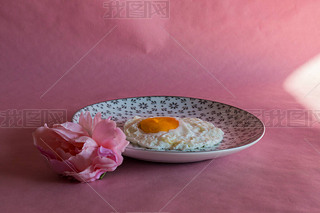Homemade meal, Organic tasty cooked eggs for healthy breakfast on pink background, fancy ceramic pla