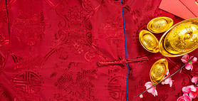 Chinese new year festival with home decoration and gold ingots on a blue color satin blanket .Chines