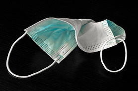 A used medical face mask protecting against respiratory diseases transmitted by airborne droplets su