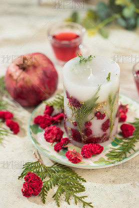 Handmade candles with dried flowers unique design. Scented candles decorated by dry leafs and blooms