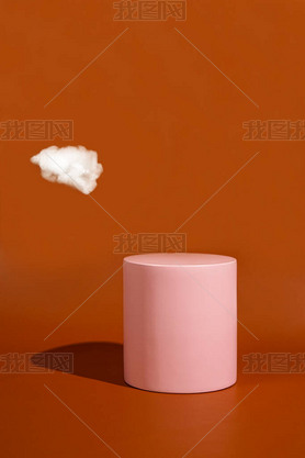 product platform arrangement in pink pastel color decorated with cotton as clouds. trendy display la