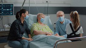 Mother and child visiting retired woman during covid 19 pandemic