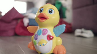 Babytoyduckmovingonfloor.Musicaltoywithbuttonandlightsmoving