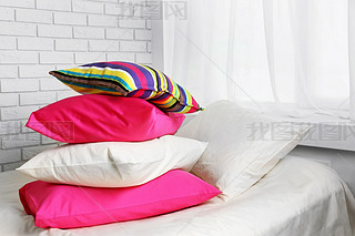 colorful pillows in bedroom