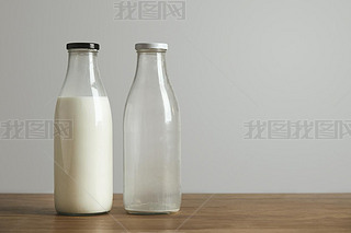Simple vintage bottles with fresh milk and empty