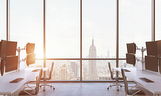 A modern trader's workplaces in a modern panoramic office in New York city. A concept of financial m