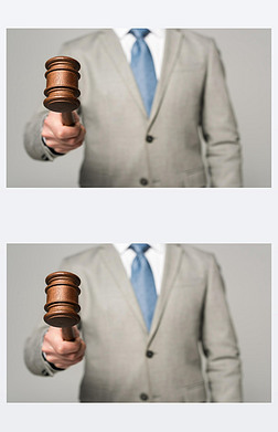 法官拿着用灰色隔离的木槌的剪影