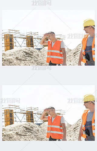 worker looking at tired colleague