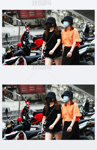 Two Chinese women are walking down the street with gauze masks on their faces. The threat of a coron