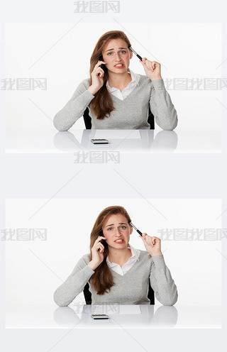 worried 20s business woman thinking on phone in white office