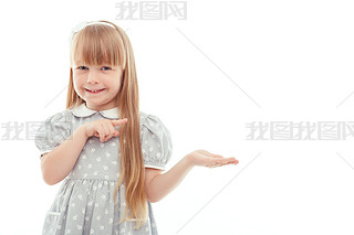 Surprised little girl pointing left