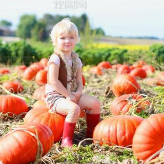 Funny little kid at the pumpkin field