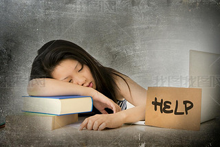 young pretty Asian Chinese woman student asleep on her laptop studying overworked with help sign on 