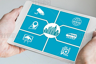 Smart city concept. Hand holding tablet or art phone with icons of connected devices.