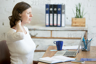 Young office woman feeling pain in the neck