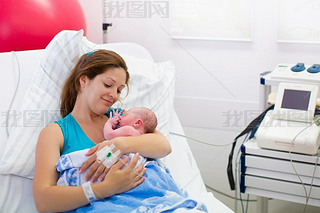 Young mother giving birth to a baby