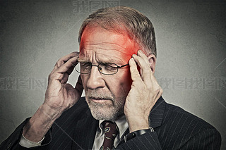 headshot senior man suffering from headache hands on head 