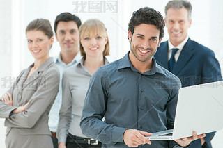 Business man holding a modern laptop