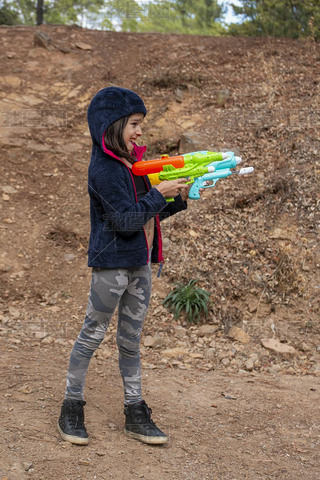 Cute girl with water gun