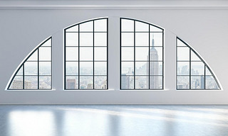 An empty modern bright and clean loft interior. New York city view. A concept of luxury open space f