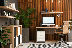 舒适的工作环境，电脑靠近木制墙壁，室内装潢时尚。家庭办公室设计