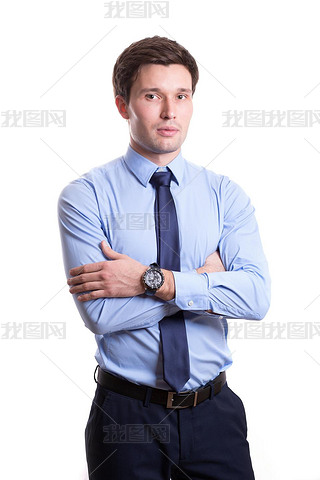 close portrait of a handsome young man in office clothes in a blue shirt trousers tie stands isolate