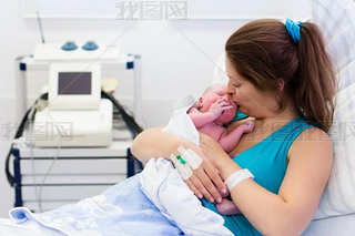 Young mother giving birth to a baby