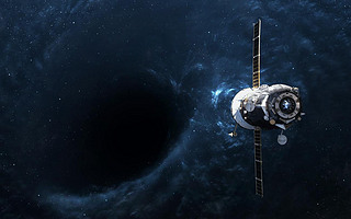 Black hole in space and spacecraft. Elements of this image furnished by NASA