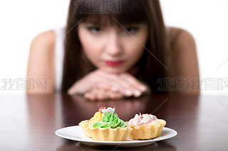 Dieting woman cring for cake