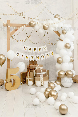 Birthday decorations - gifts, toys, balloons, garland and number for little baby party event on a wh